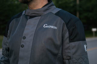 close up photo of a man in gryphon motorcycle jacket showing the large mesh panels of the jacket
